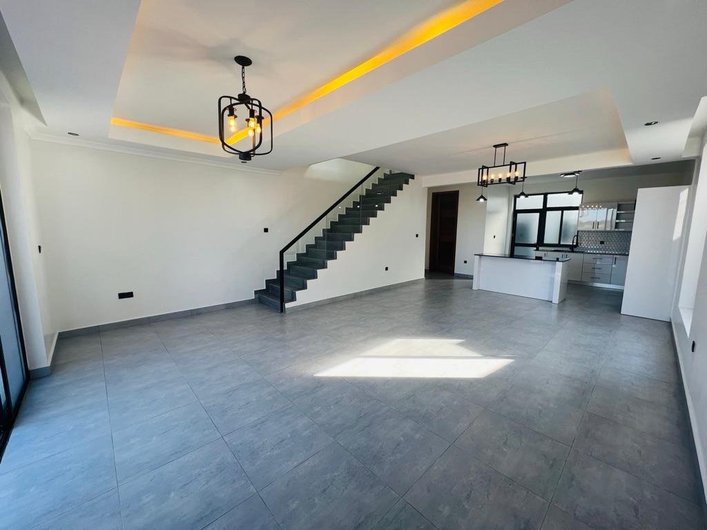 Principium House, Kigali — open-plan living and kitchen